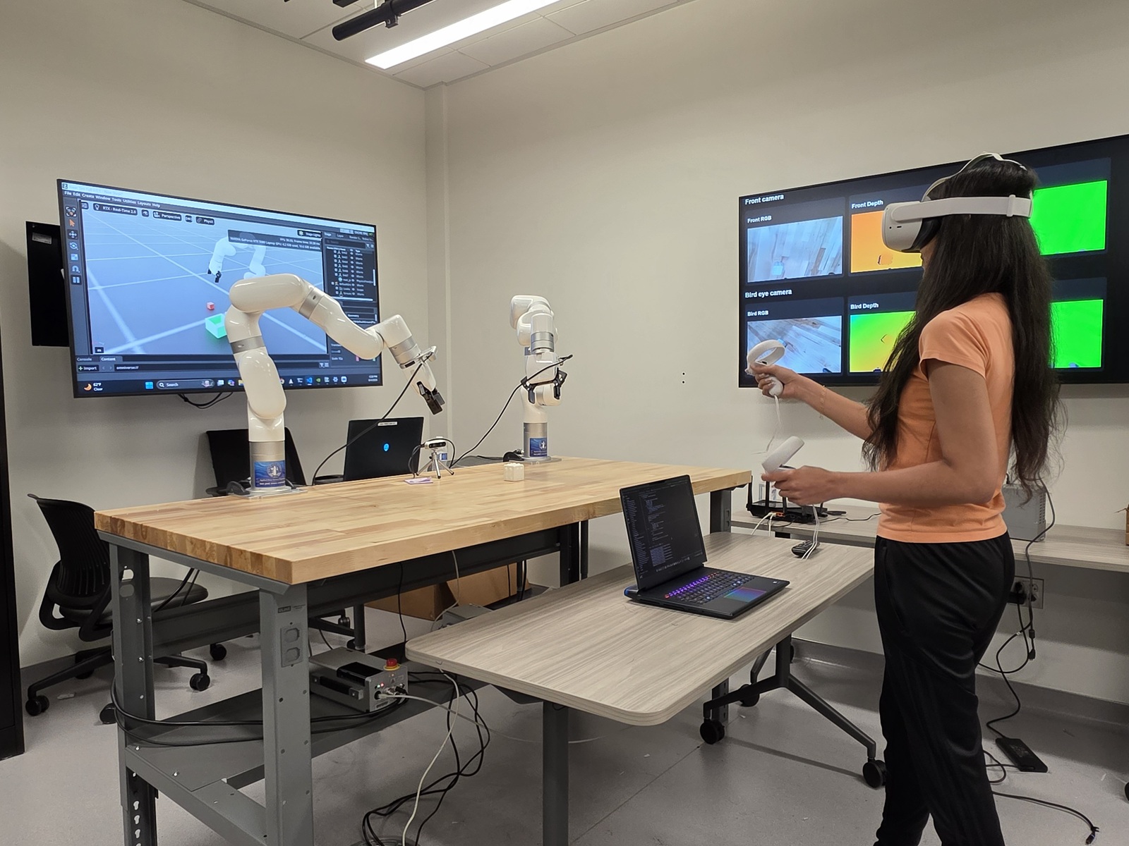 Twin Lab student with robotic arm