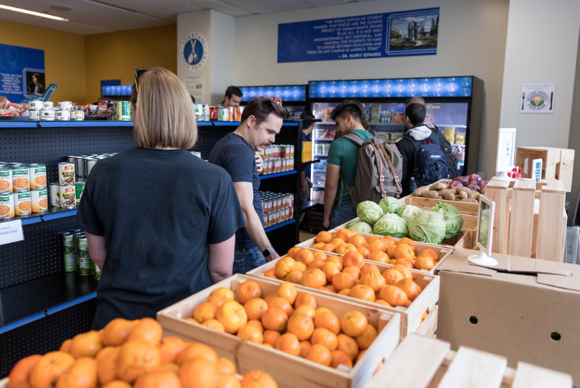 People exploring food at the SJSU Spartan Food Pantry.